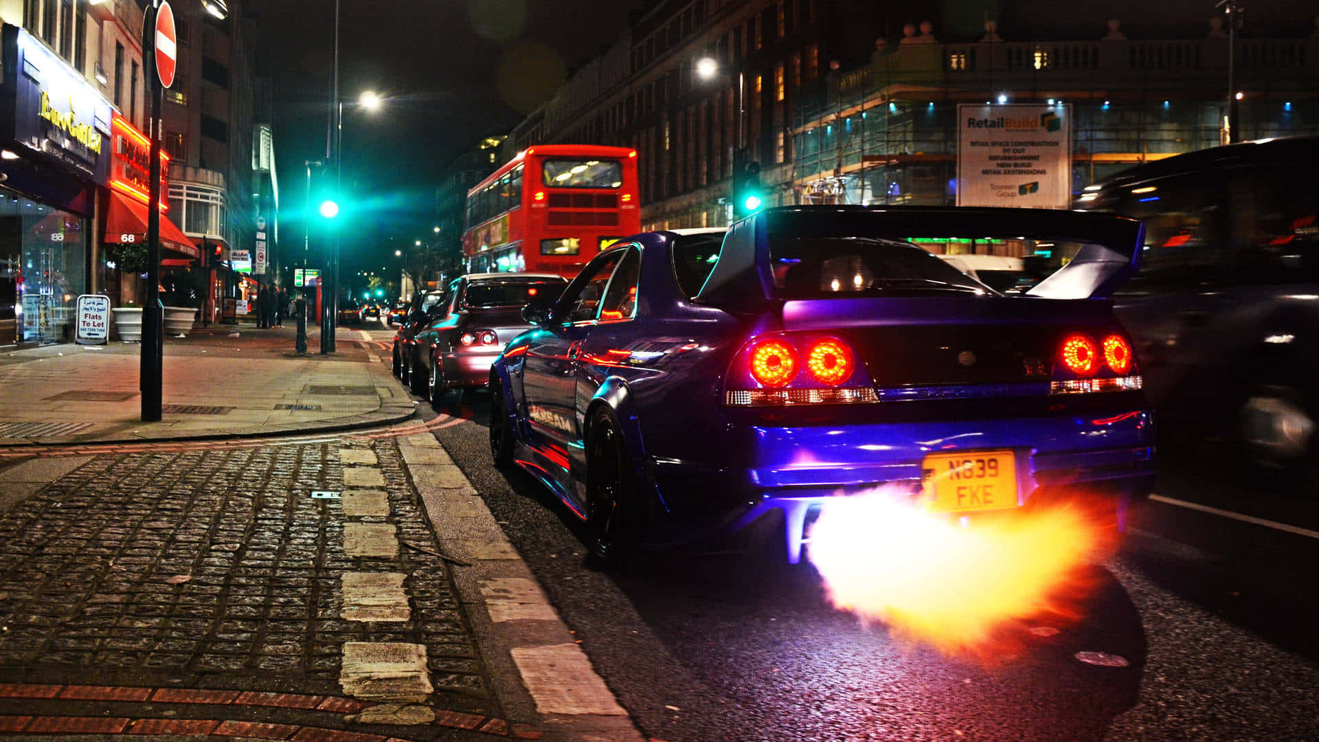 A Car With A Blue Exhaust Background