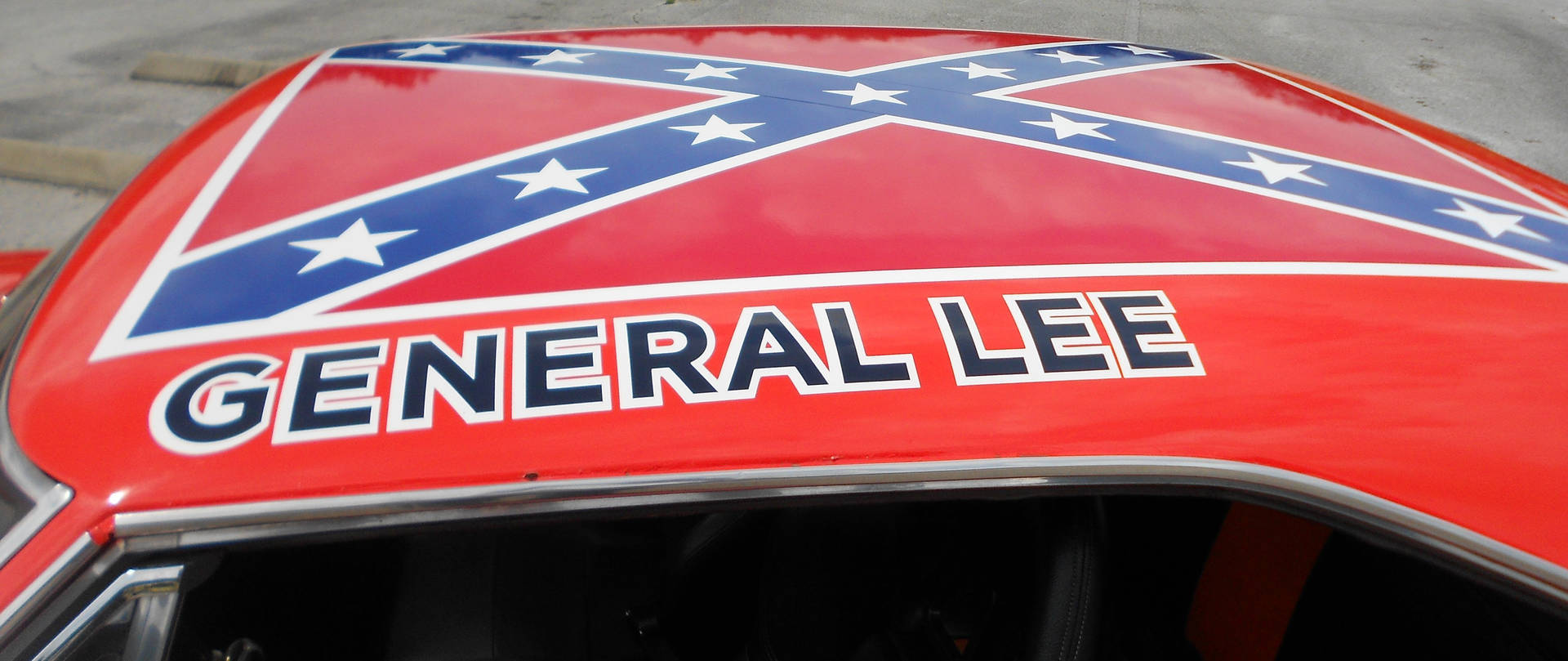 A Car With The Word General Lee On The Hood Background