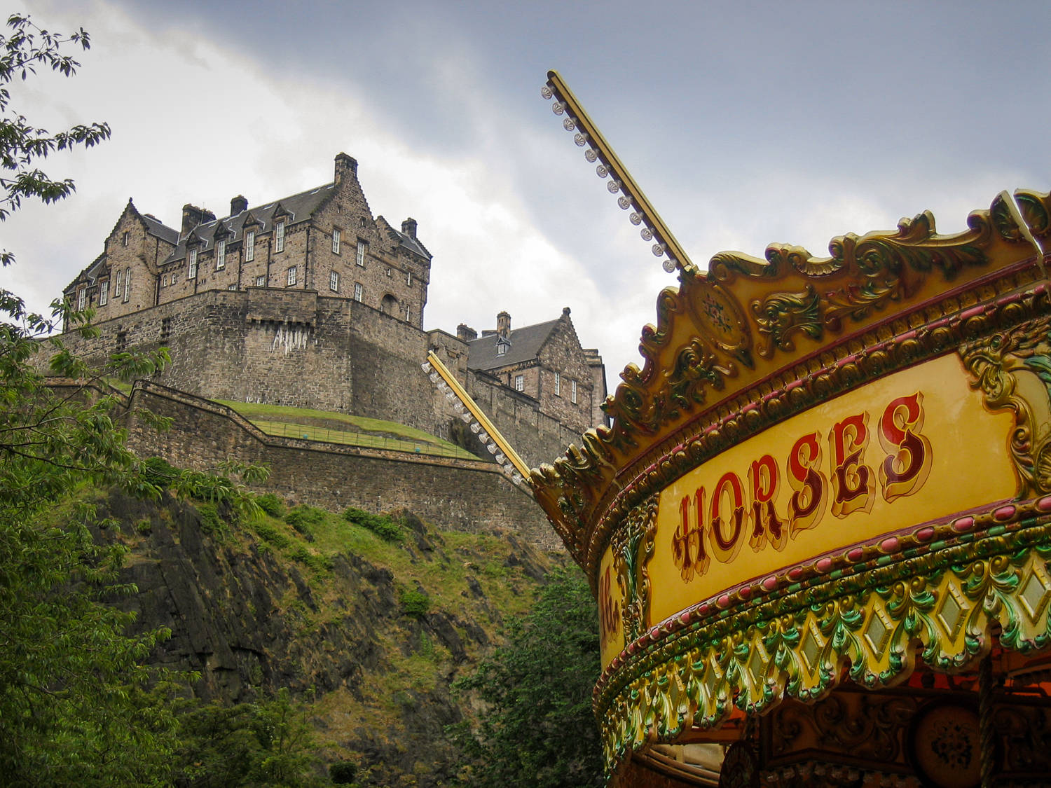 A Carousel Below Edinburgh Castle Background