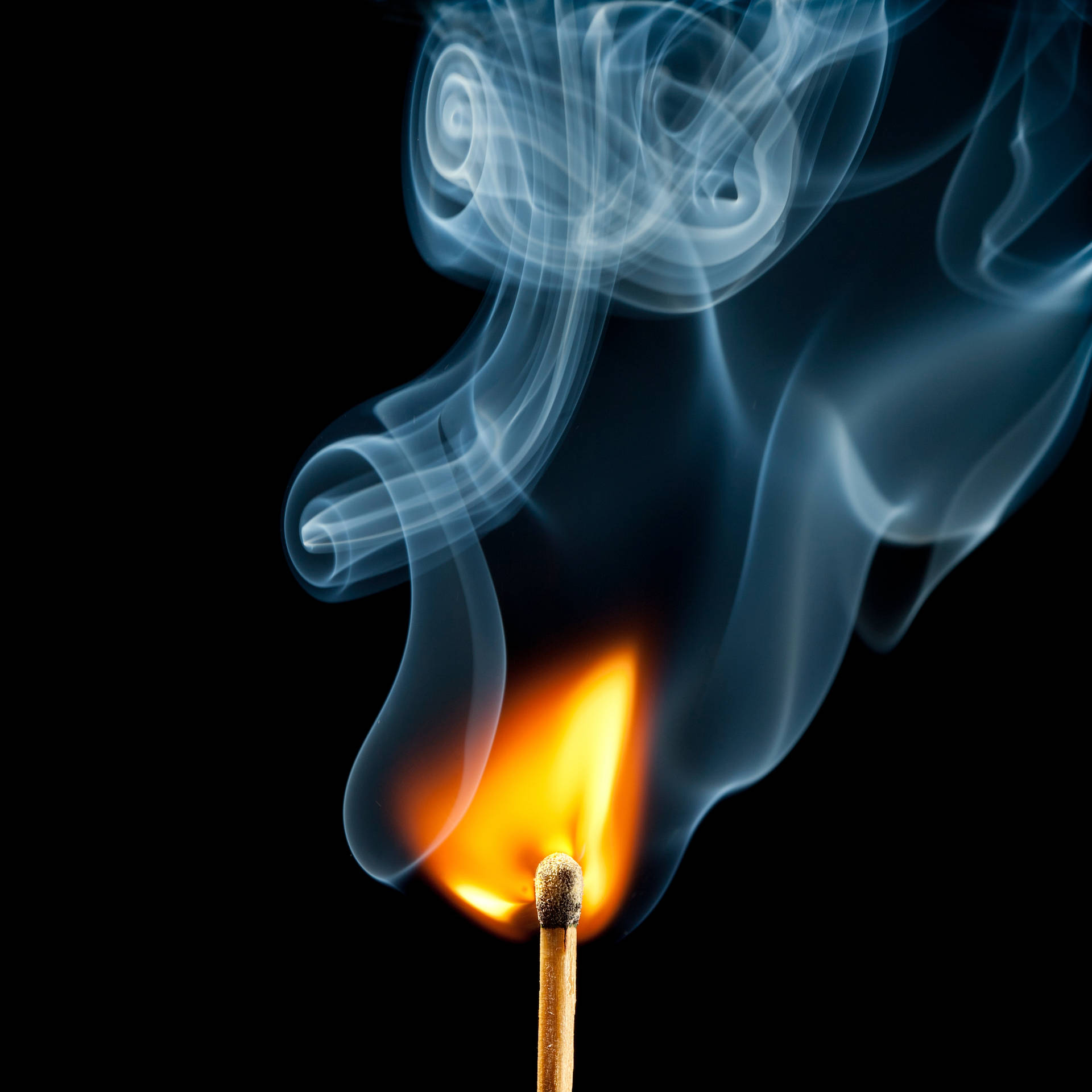 A Cascading Blue Smoke Rises Against A Black Background Background