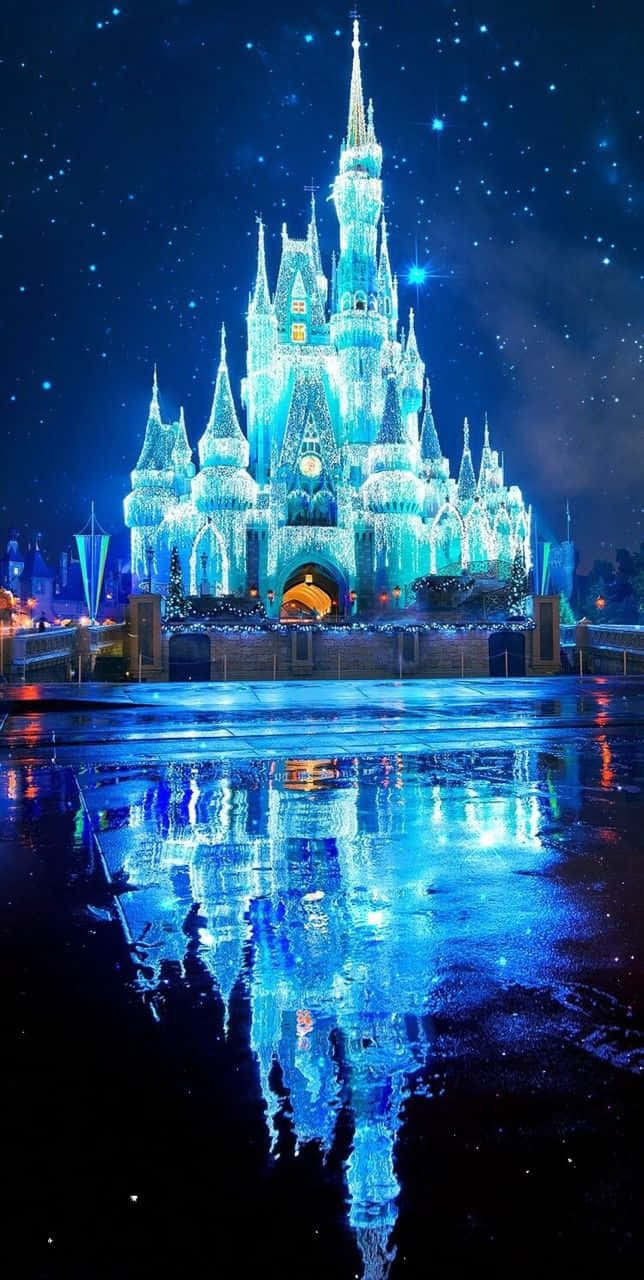 A Castle Is Lit Up With Blue Lights At Night Background