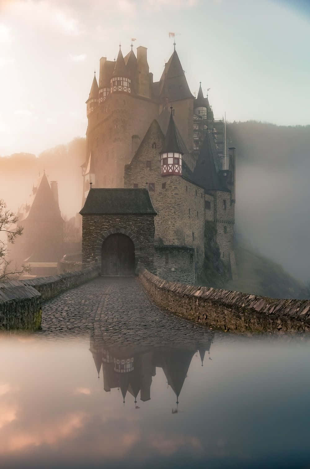 A Castle Is Reflected In The Water Background