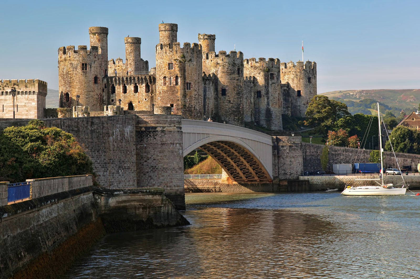 A Castle With A Bridge Over A Body Of Water