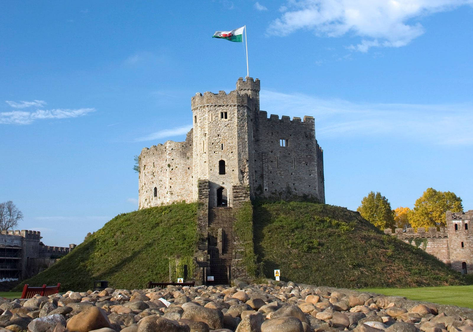 A Castle With A Flag On Top Of It Background