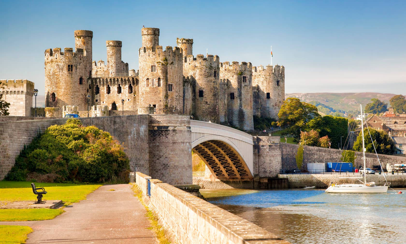 A Castle With Boats On The Water Background