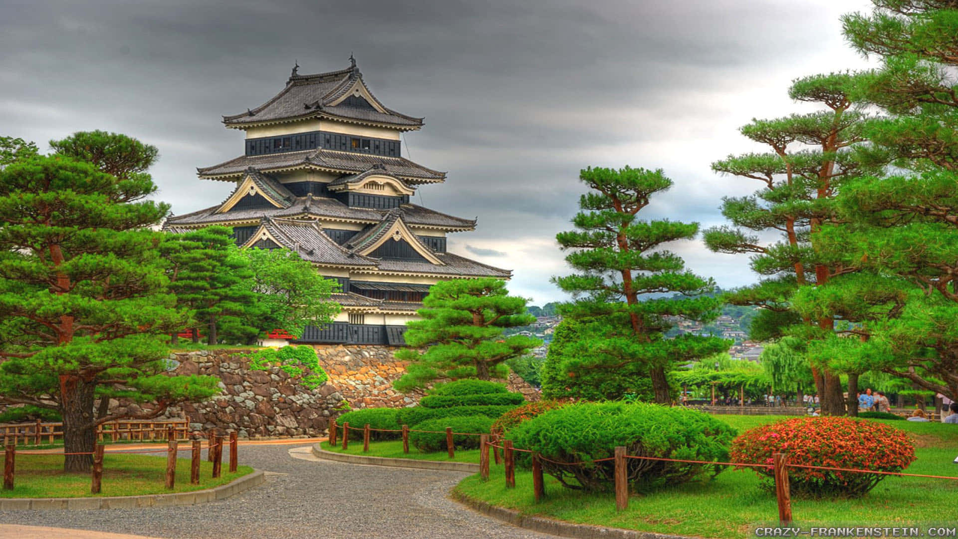 A Castle With Trees And Bushes Background