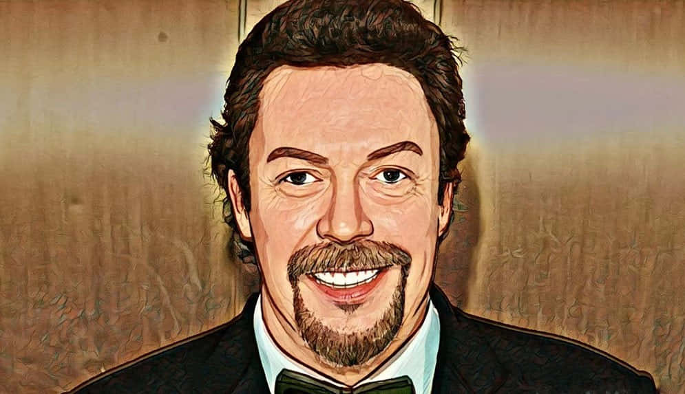 A Charismatic Tim Curry Grinning In A Close-up Shot