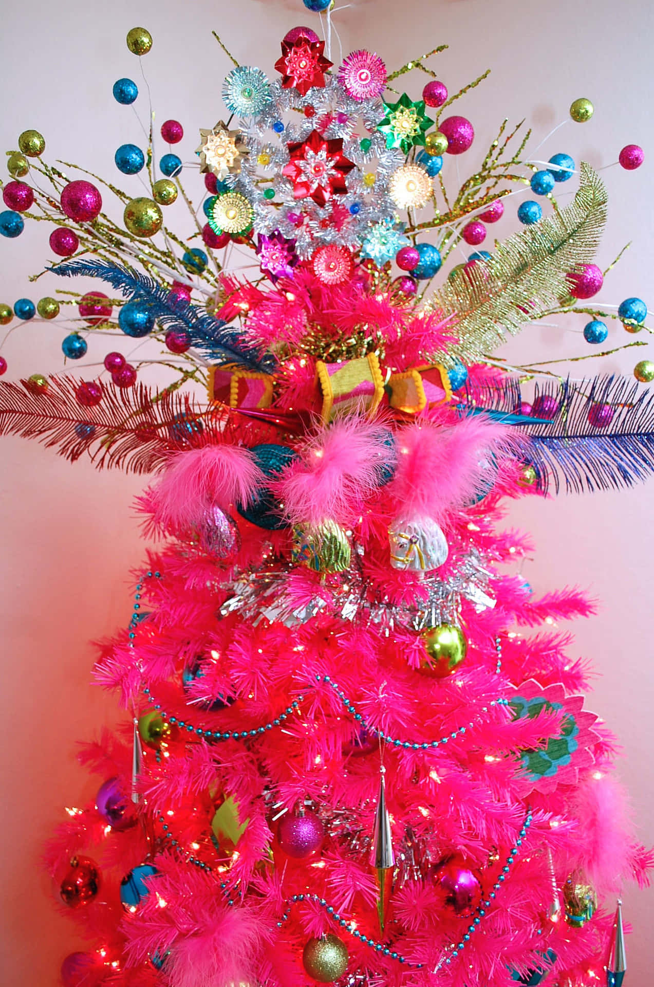 A Cheerful Pink Christmas Tree Perfect For The Holiday Season Background