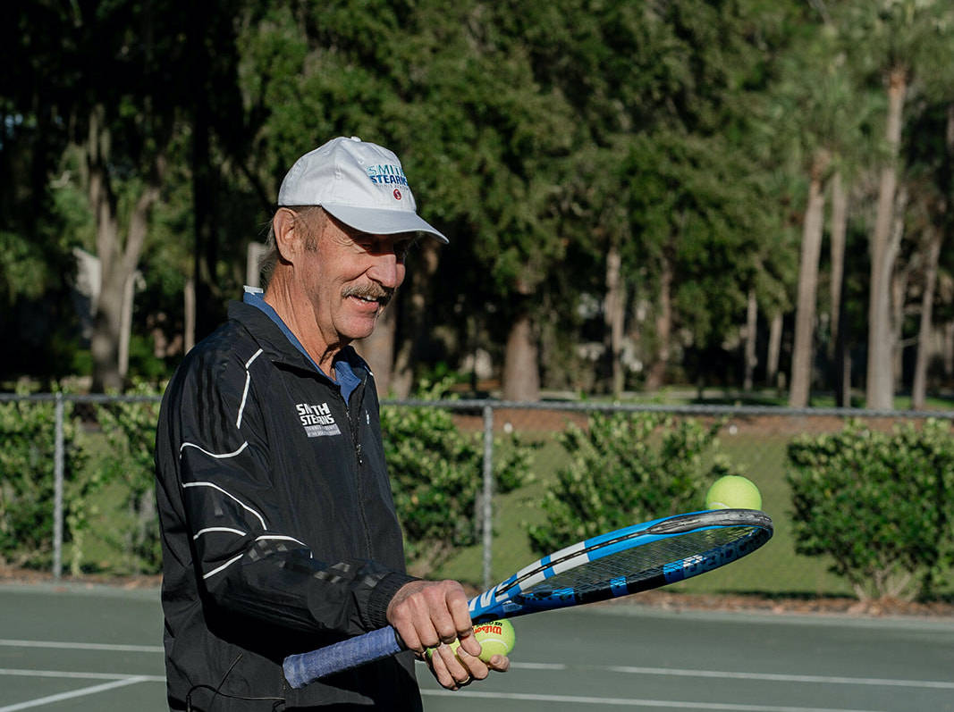 A Cheerful Portrait Of Stan Smith Background