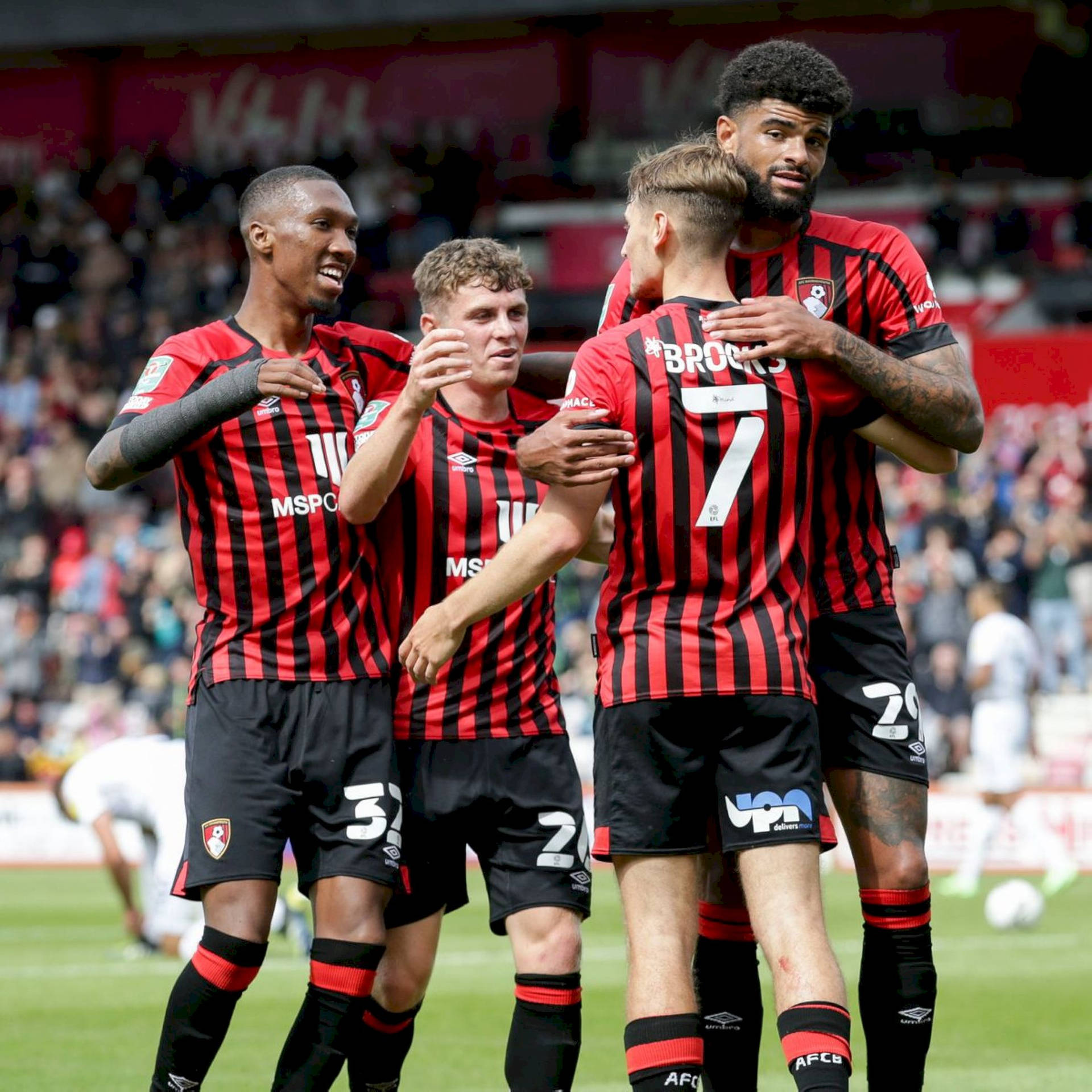 A Cherished Team Moment - Afc Bournemouth Group Hug Background