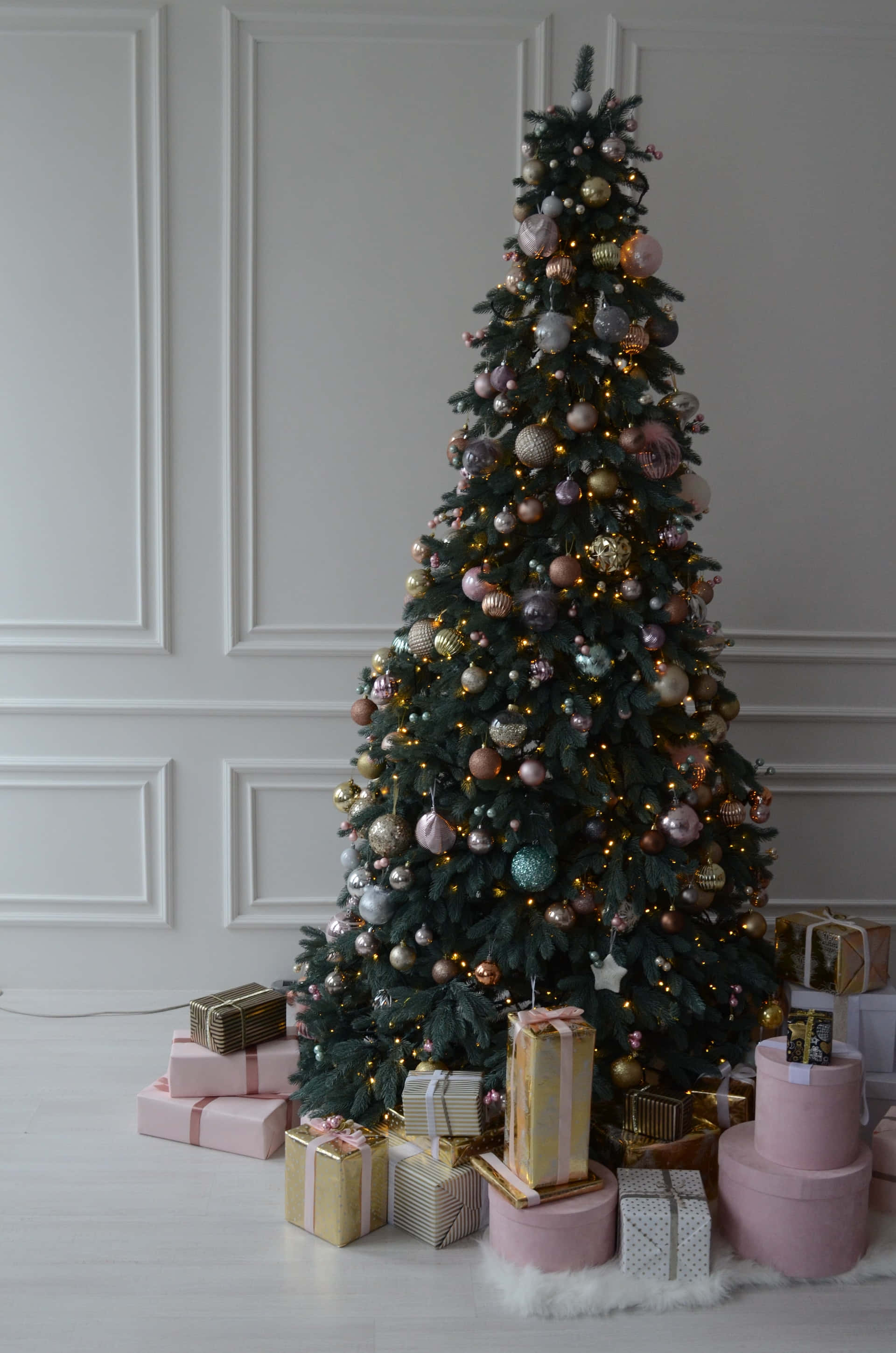 A Christmas Tree With Presents On The Floor