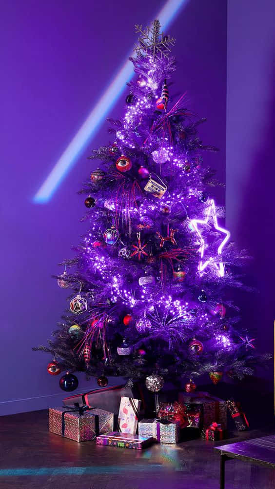 A Christmas Tree With Purple Lights In A Room Background