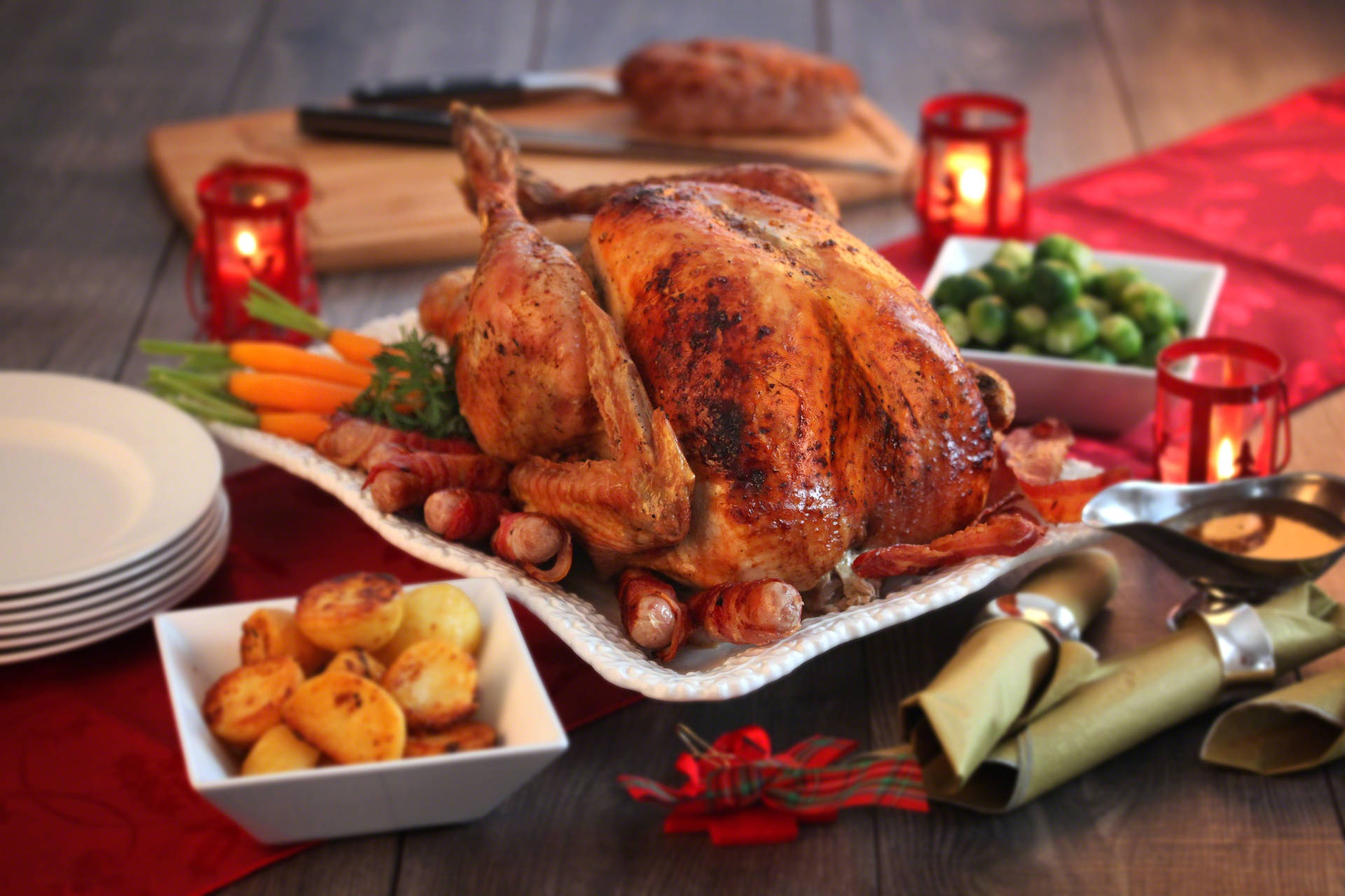 A Christmas Turkey With Potatoes And Vegetables On A Table Background