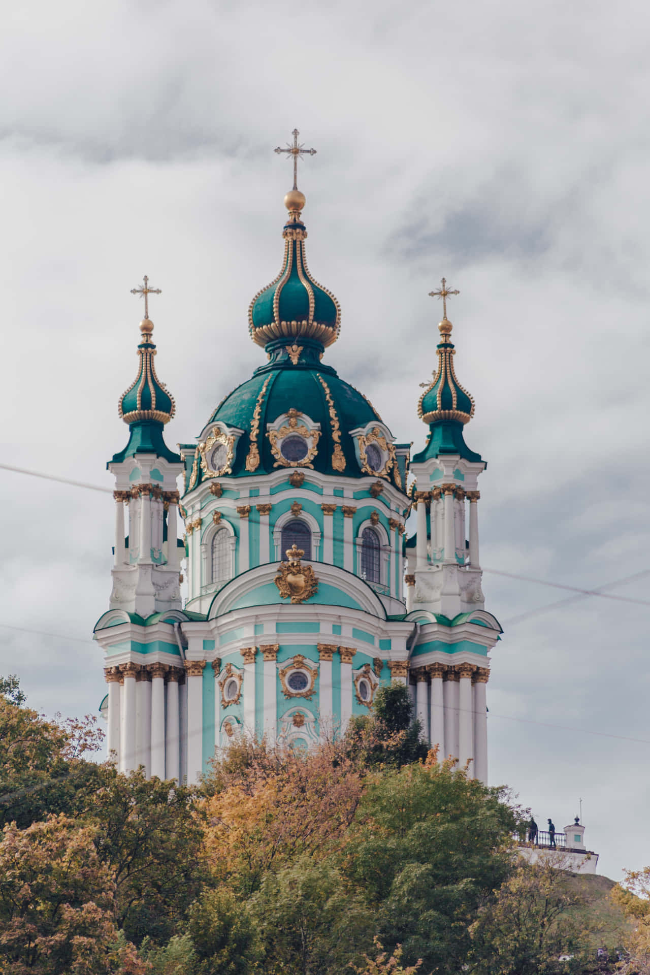 A Church With A Green Dome On Top Of It Background