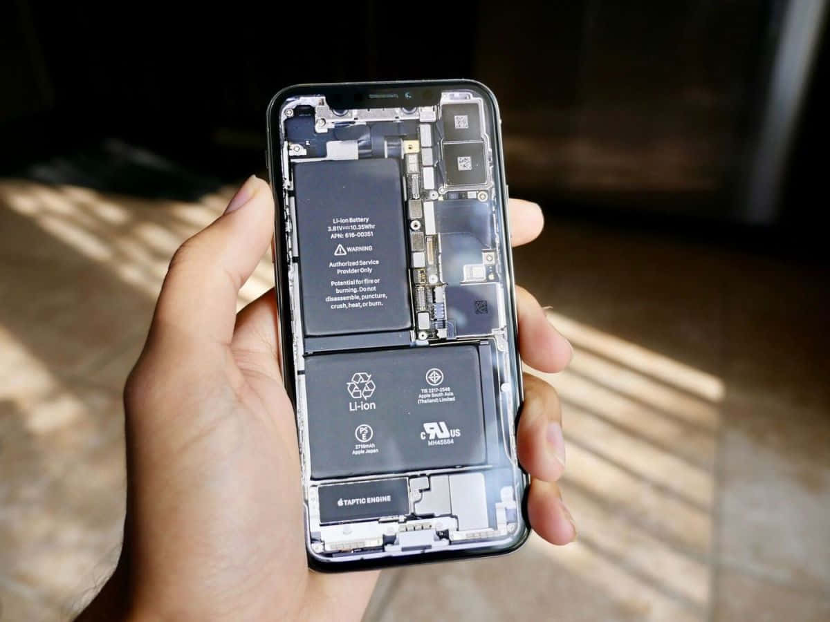 A Circuitry Maze: See The Intricate Details Of Phone Inside Background