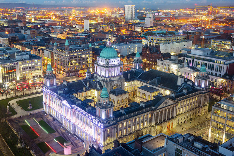 A City At Night With A Large Building