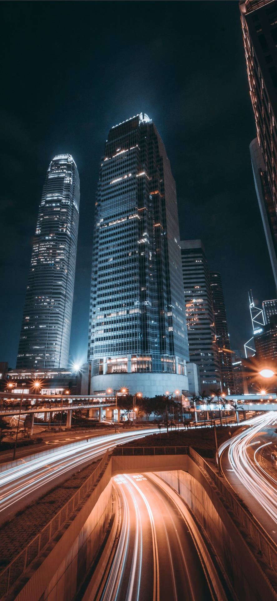 A City At Night With Light Trails Background