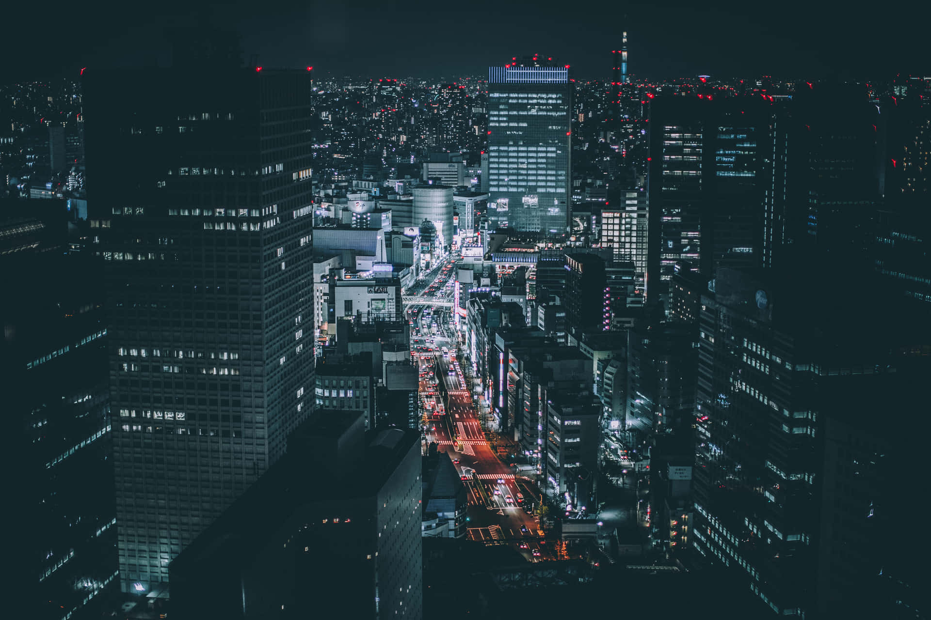 A City At Night With Lights And Buildings Background