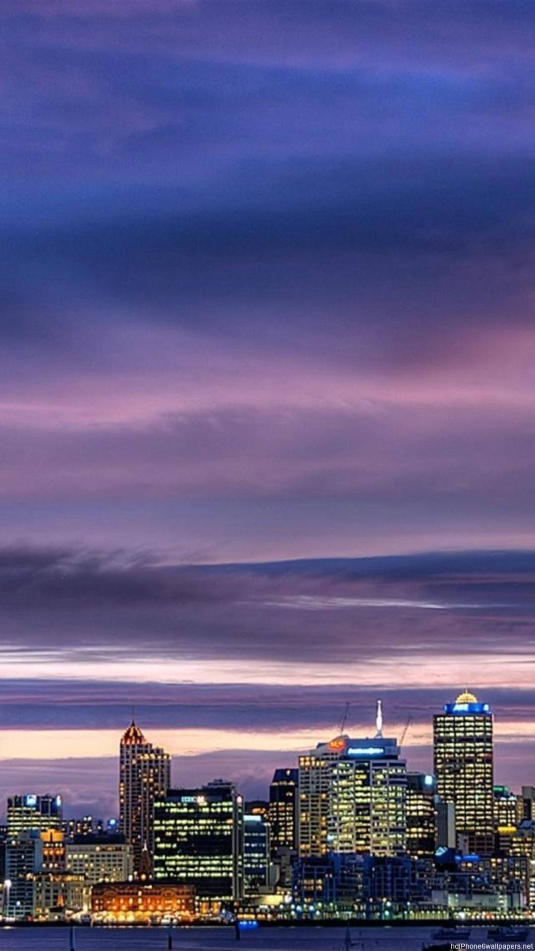 A City Skyline With A Boat In The Water Background