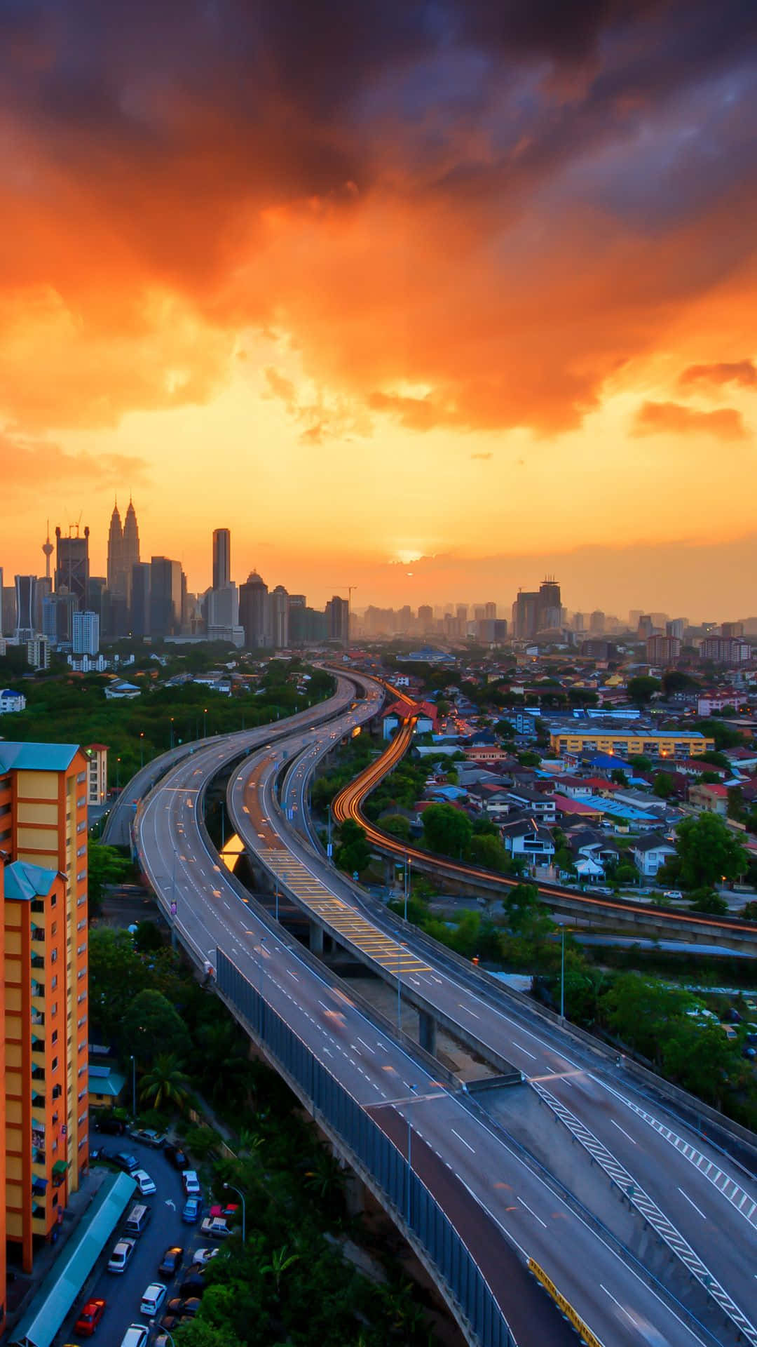 A City Skyline With A Cloudy Sky Background