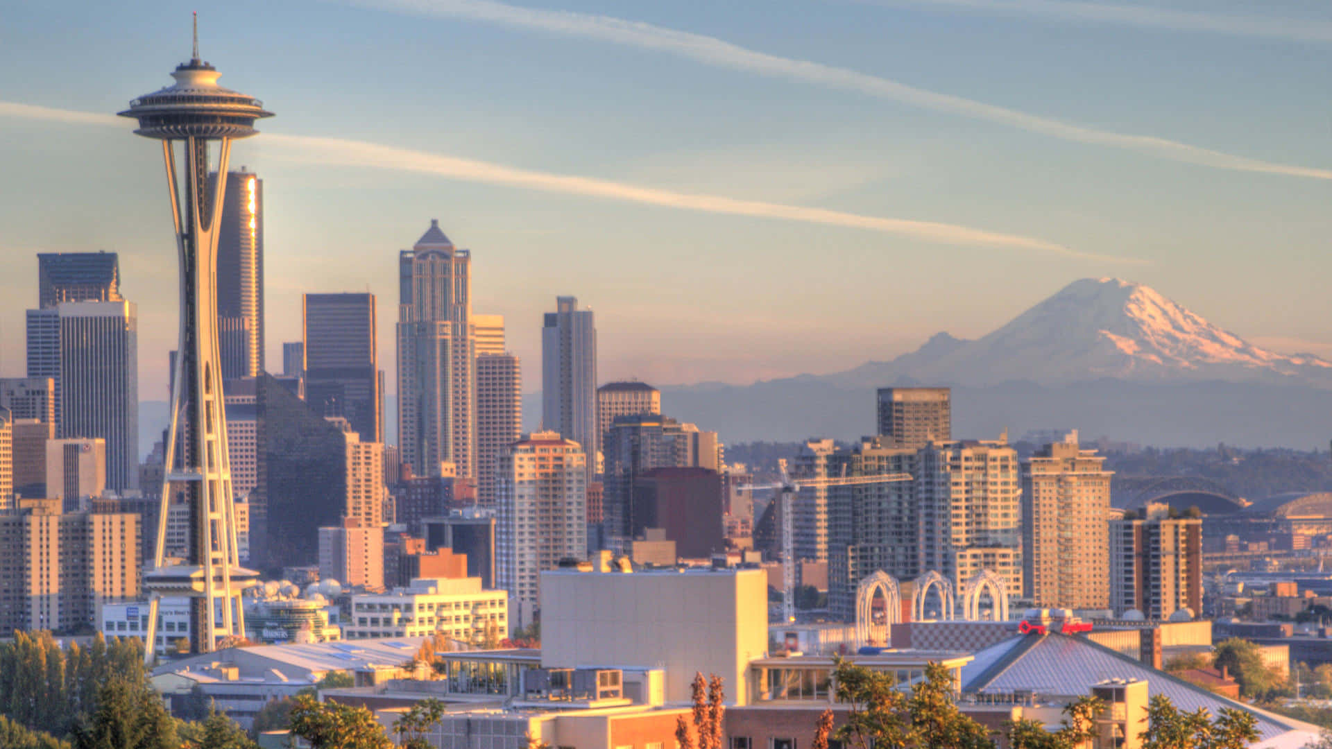 A City Skyline With A Mountain In The Background Background