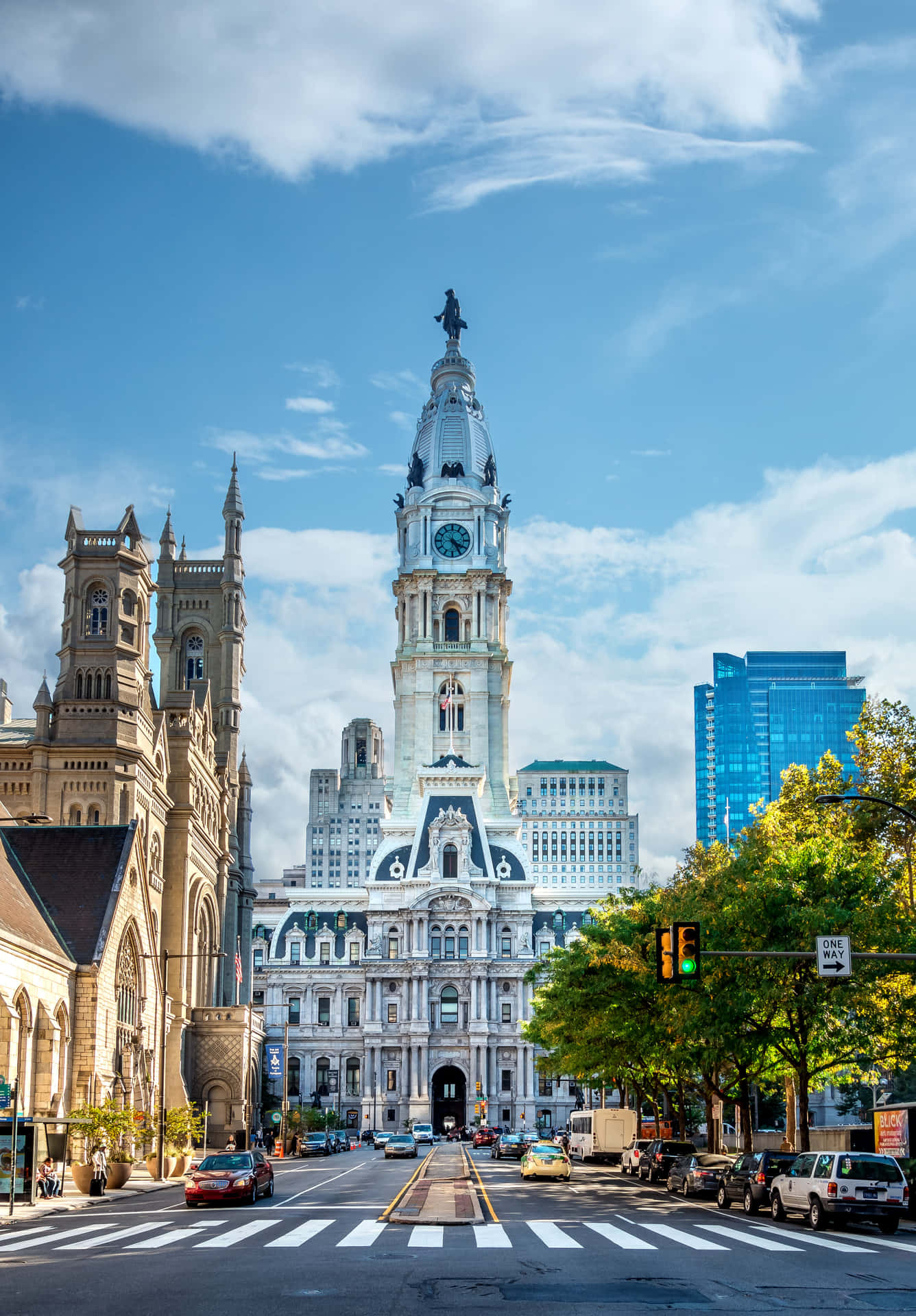 A City Street With A Clock Tower And A City Hall Background