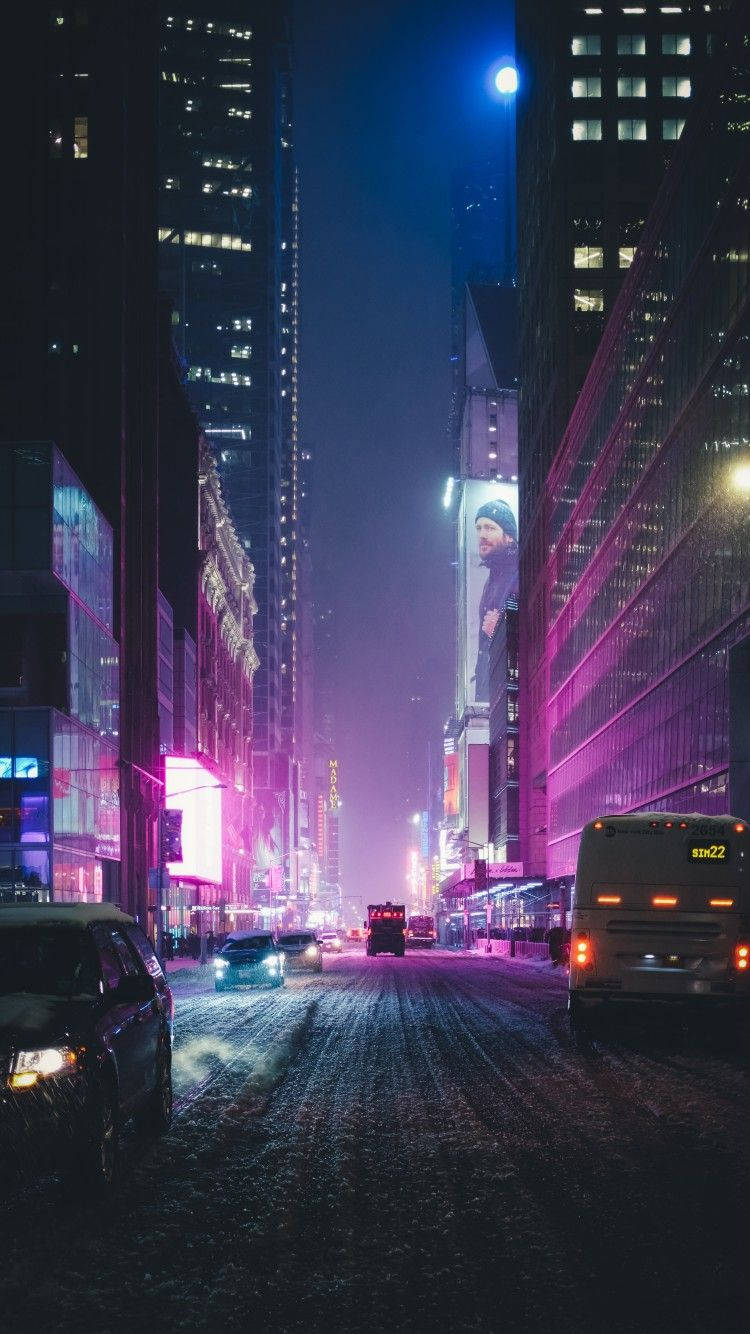 A City Street With Cars And Neon Lights Background