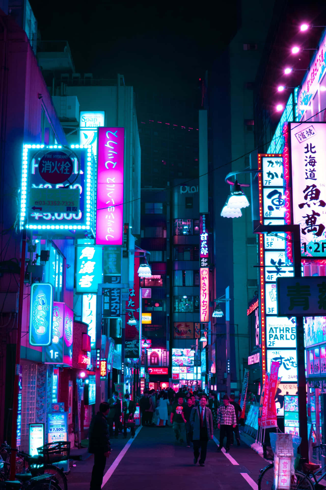 A City Street With Neon Signs Background