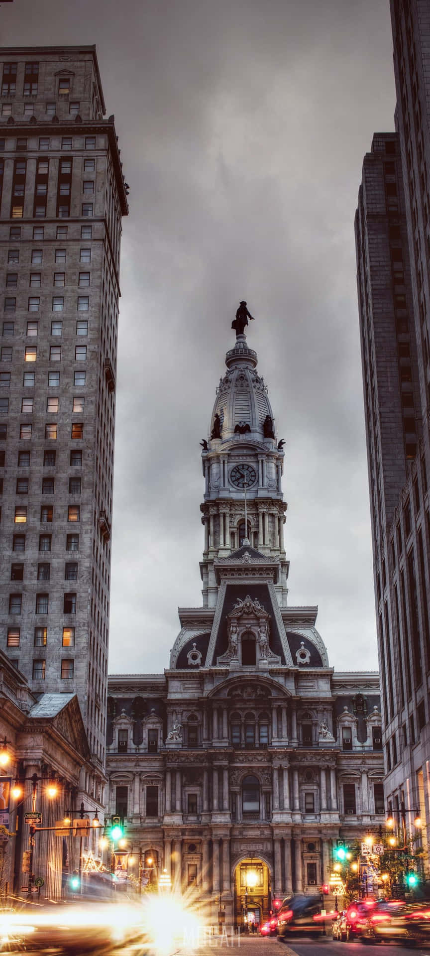 A City With A Clock Tower And Tall Buildings Background