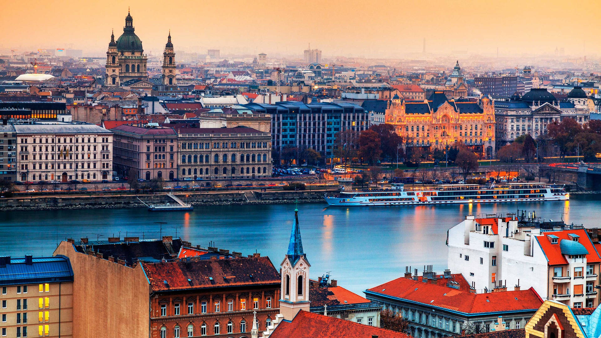 A City With A River And Buildings Background