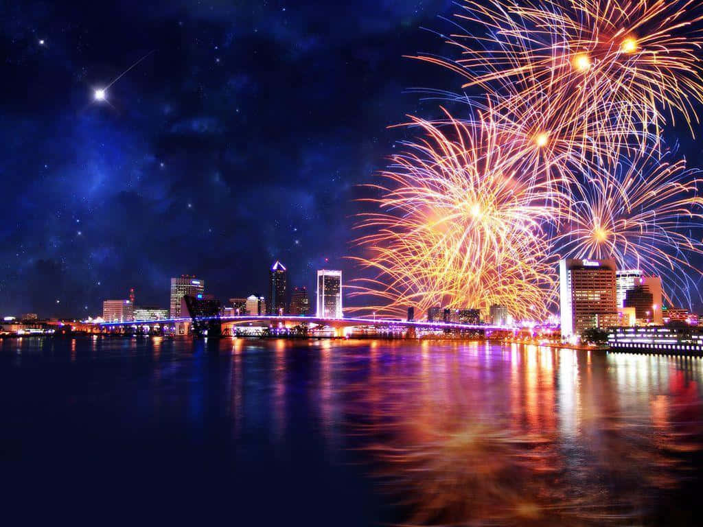 A City With Fireworks Over The Water Background