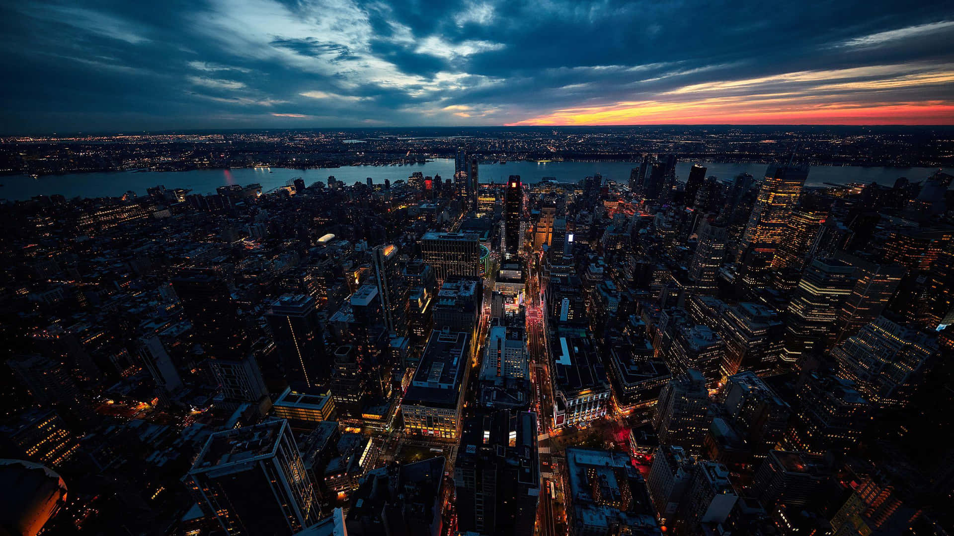 A Cityscape At Dusk With A City Skyline Background