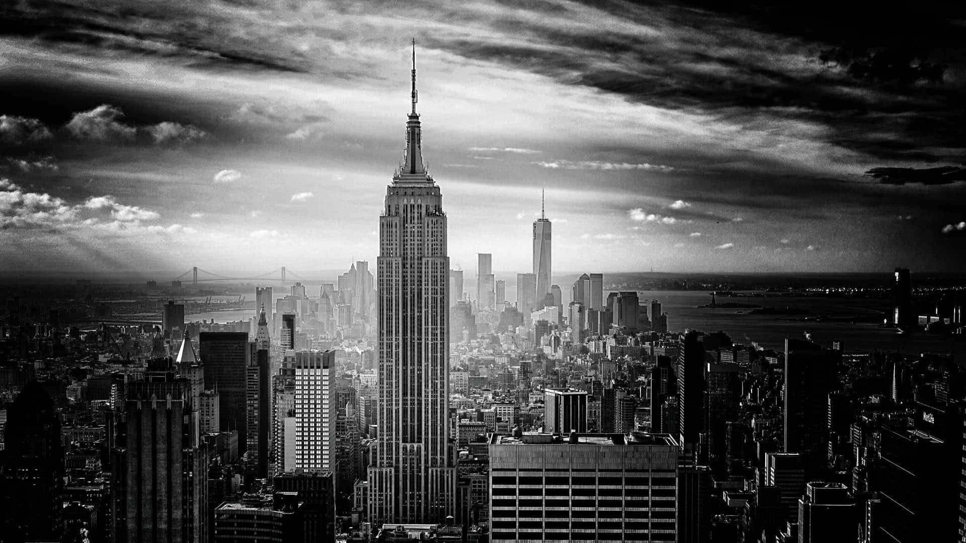 A Cityscape Silhouetted Against Night Sky Background