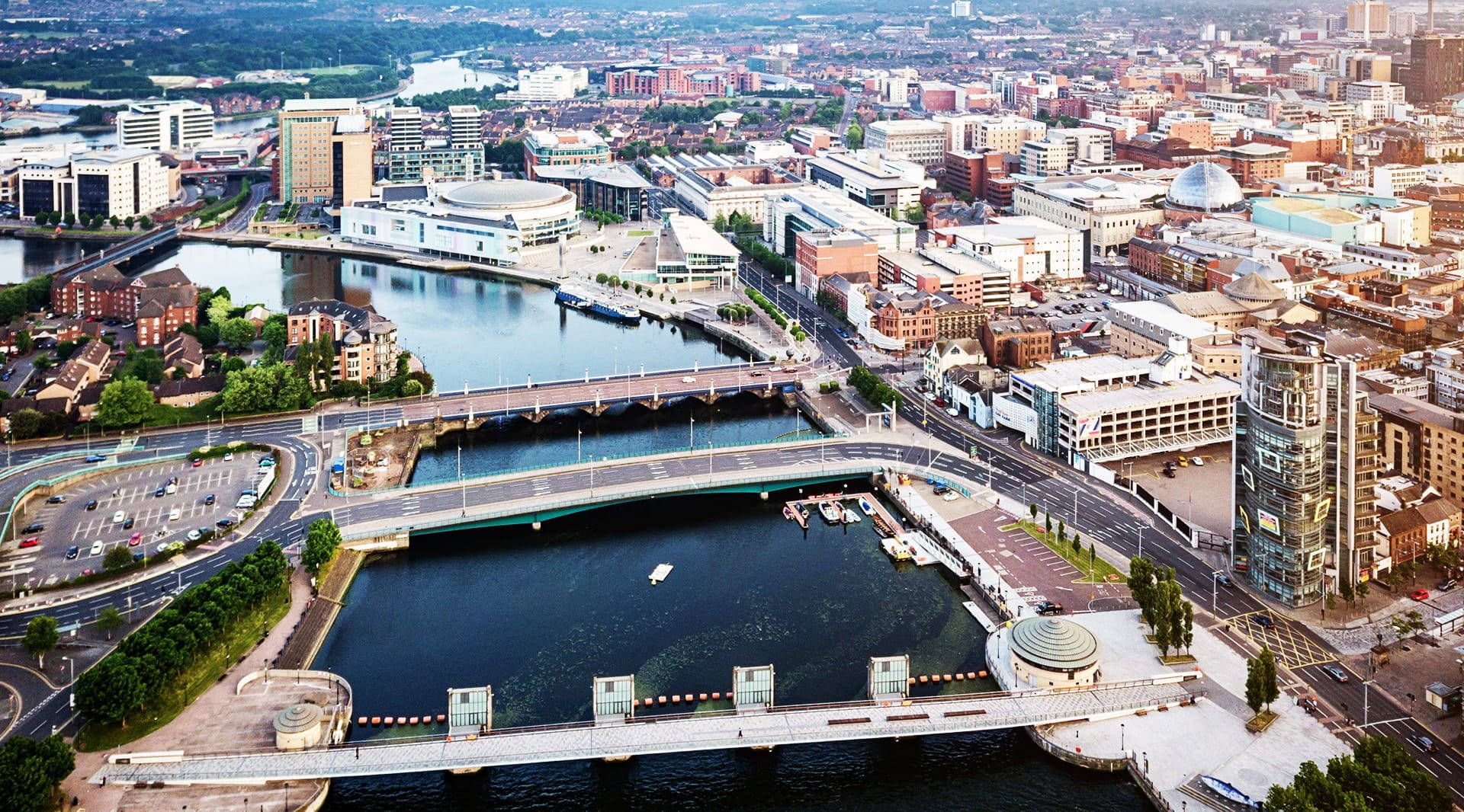 A Cityscape With A River And Buildings Background