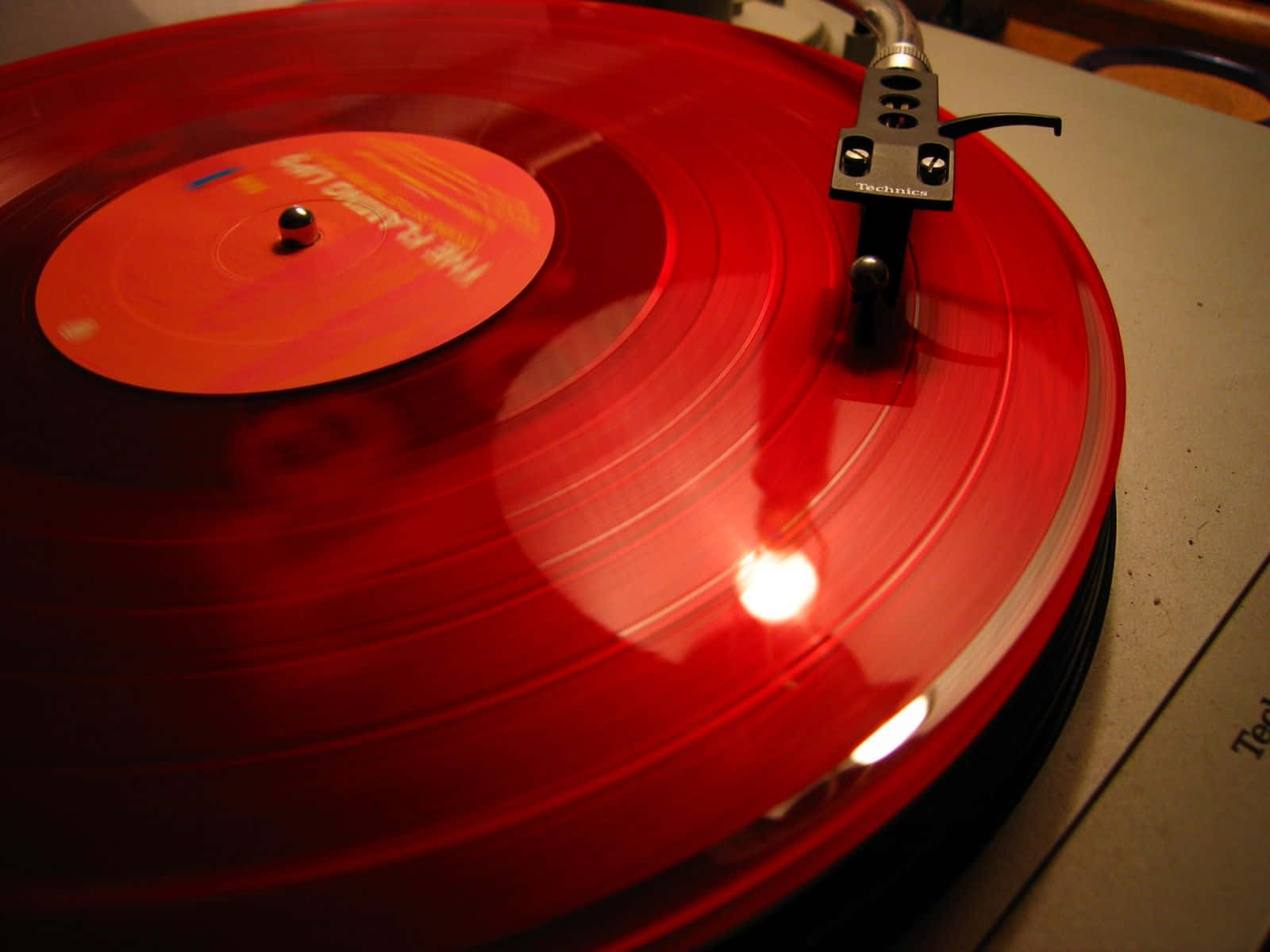 A Classic Black Vinyl Record Player Rotating A Vintage Vinyl Record Background