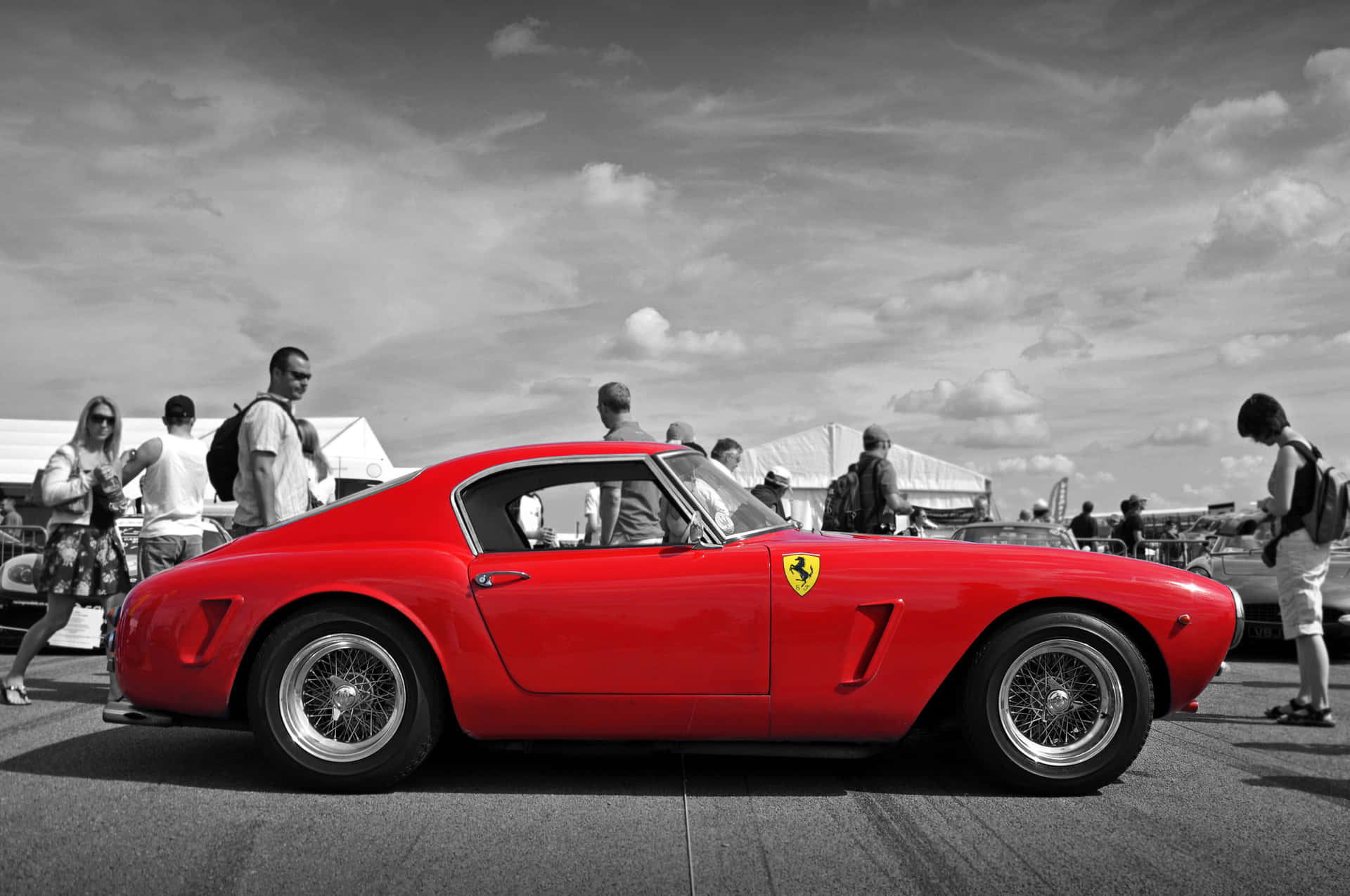 A Classic Ferrari Lit Up In Yellow Lights. Background