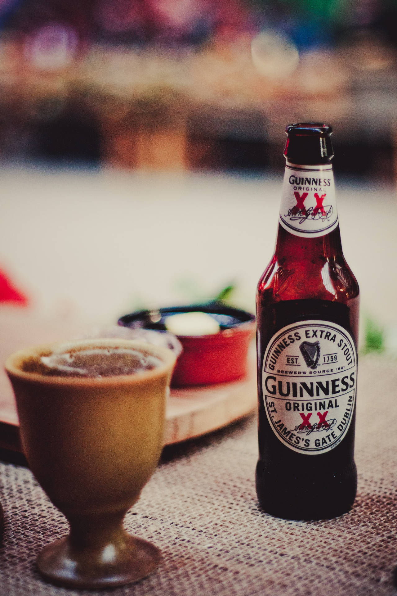 A Classic Pint Of Guinness Stout Beer Waiting To Be Enjoyed. Background