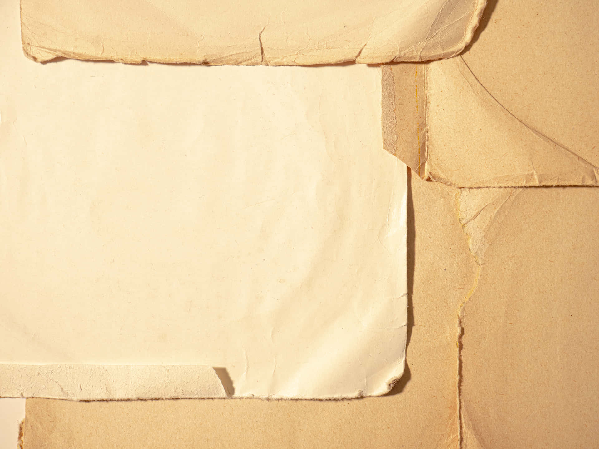 A Close-up Image Of Paper With Torn Edges