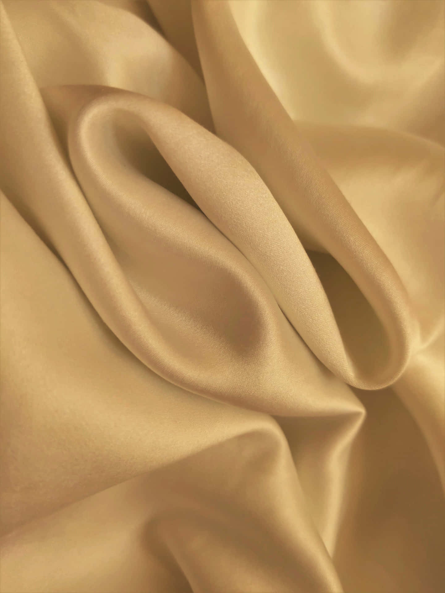 A Close Up Of A Beige Silk Fabric Background