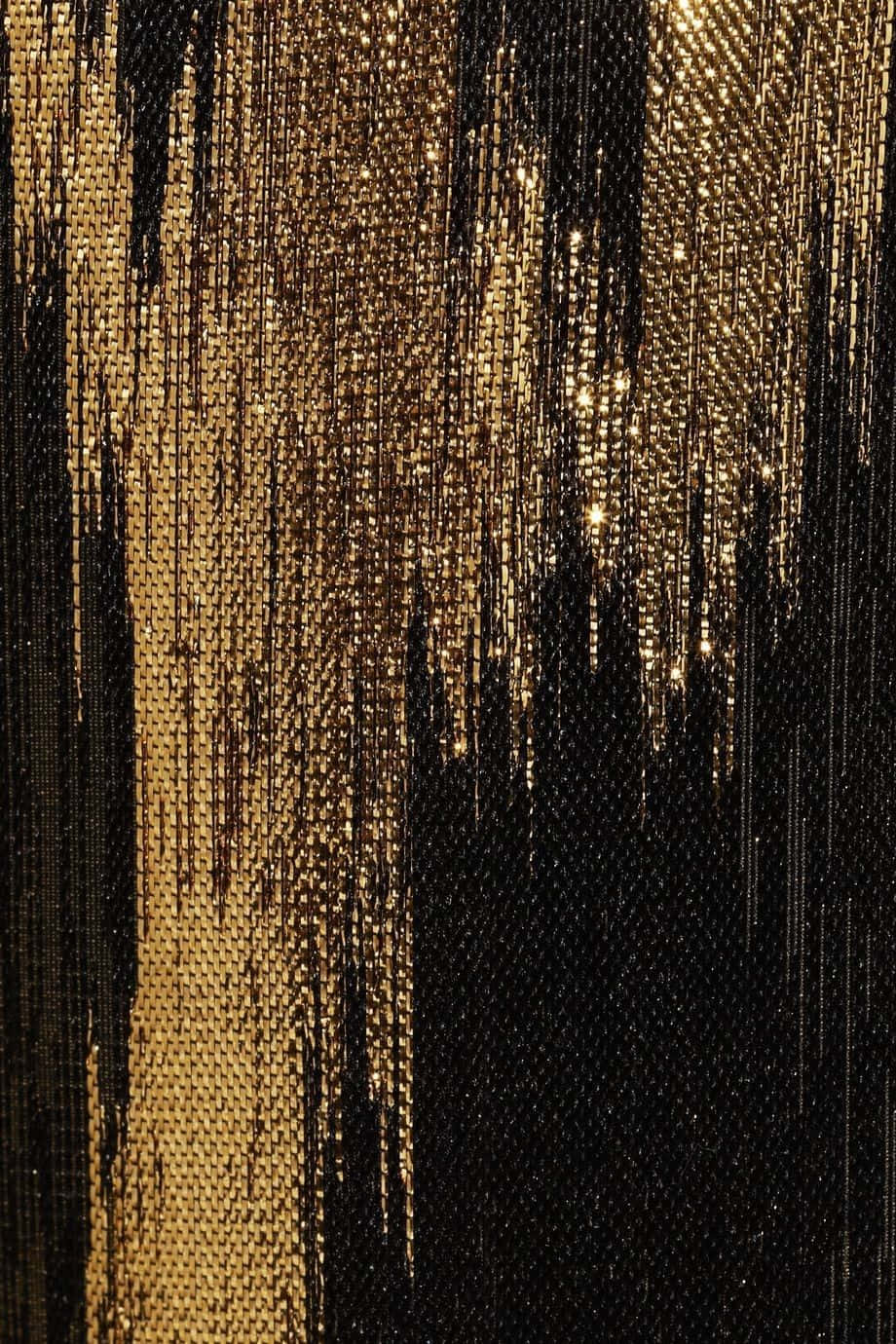 A Close Up Of A Black And Gold Sequin Dress Background