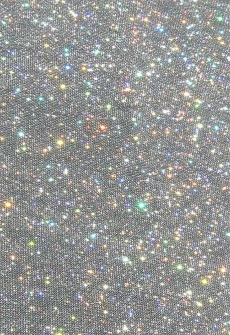 A Close Up Of A Black Fabric With Multi Colored Stars
