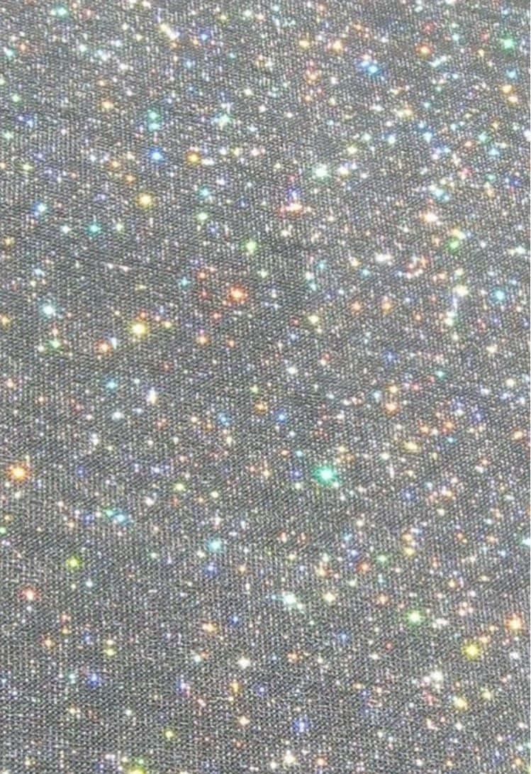 A Close Up Of A Black Fabric With Multi Colored Stars Background