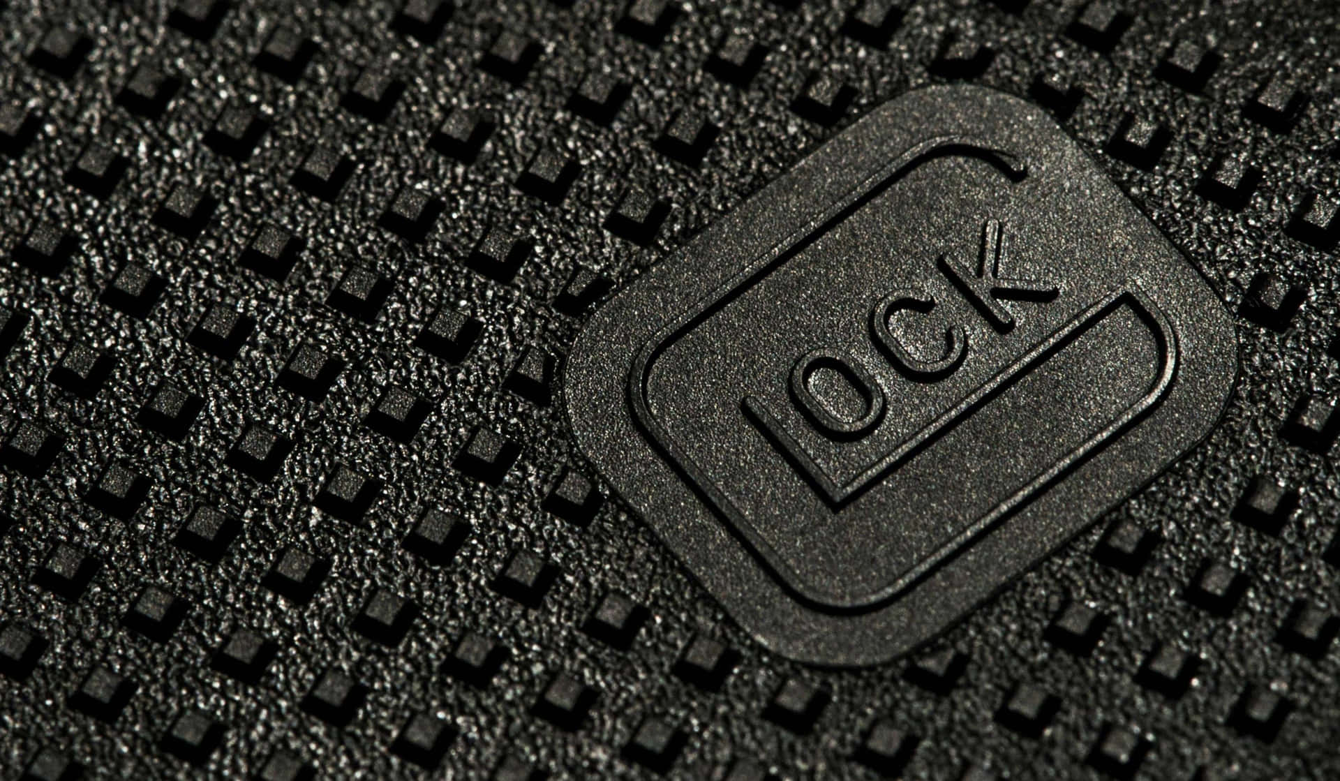 A Close Up Of A Black Leather Bag With A Logo On It Background