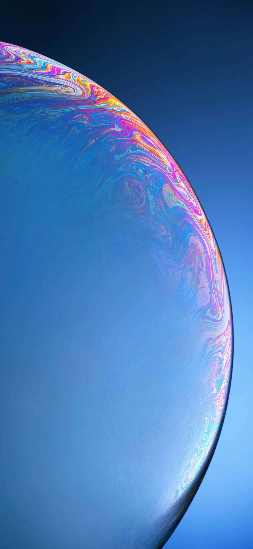 A Close Up Of A Blue Bubble With A Colorful Background Background