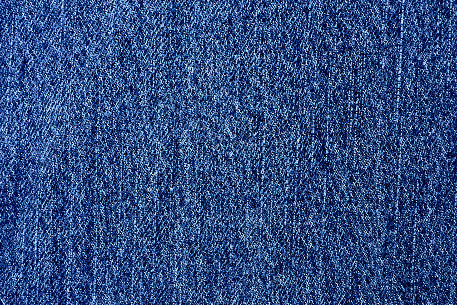 A Close Up Of A Blue Denim Fabric Background