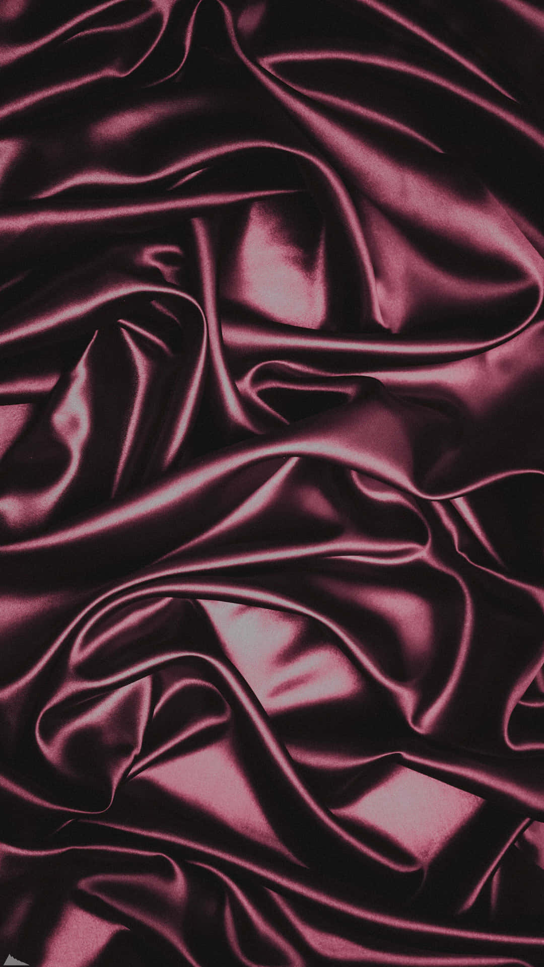 A Close Up Of A Burgundy Satin Fabric Background