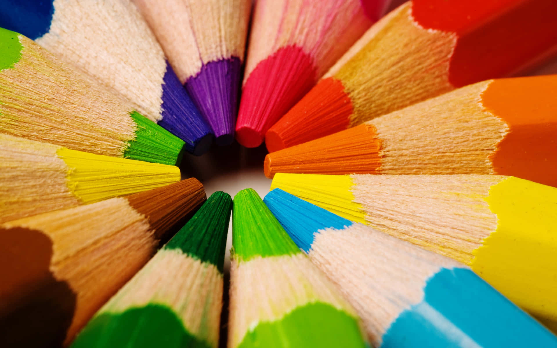 A Close Up Of A Circle Of Colored Pencils