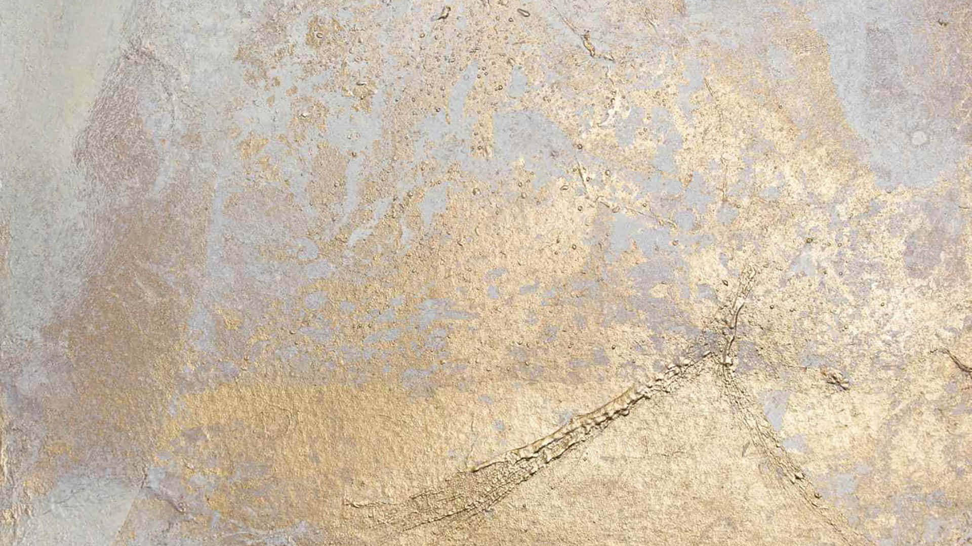 A Close Up Of A Gold And Silver Painted Wall