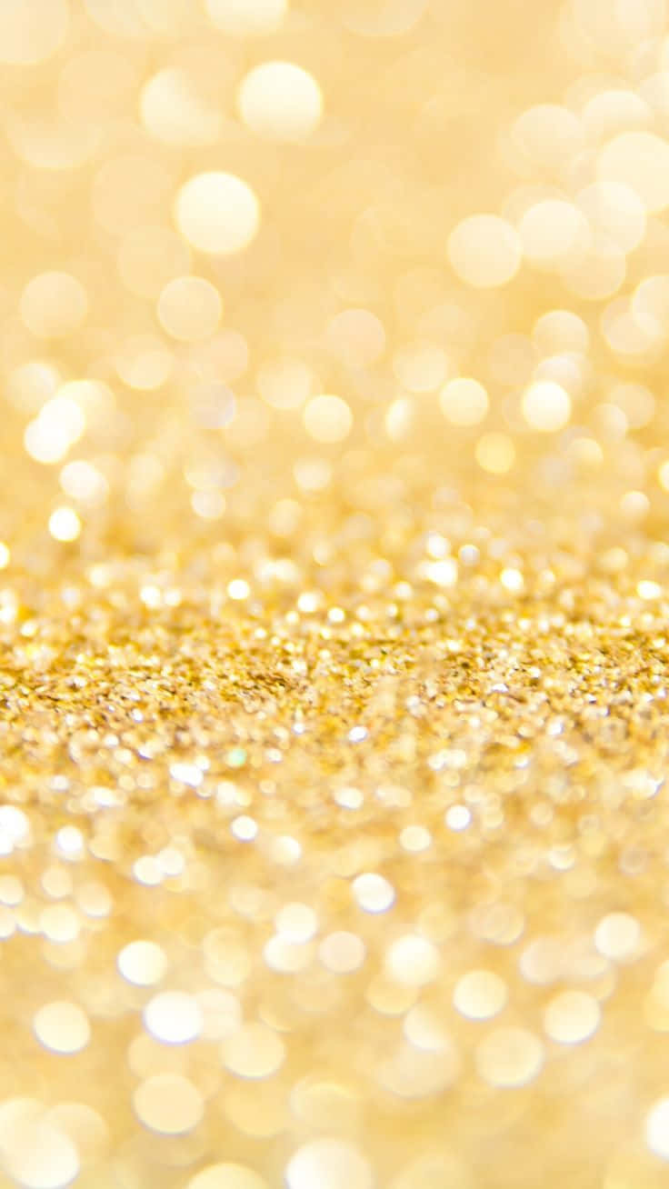 A Close Up Of A Gold Glitter Background Background