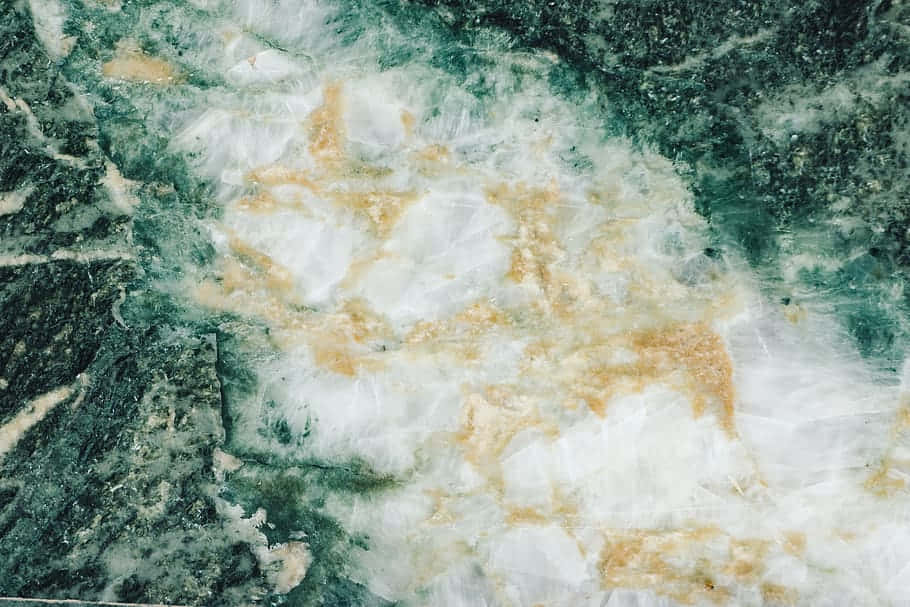 A Close Up Of A Green Marble Background